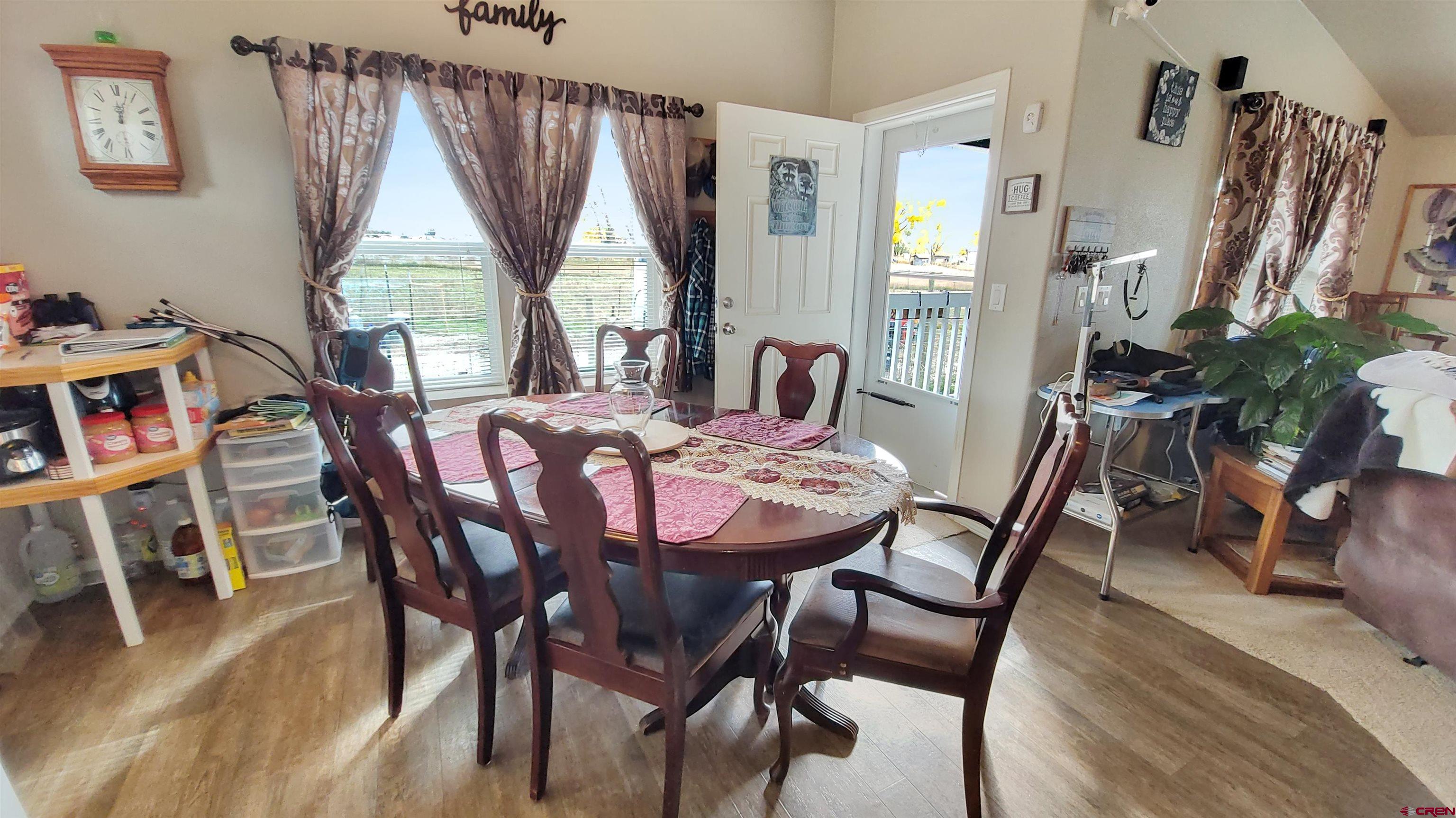 13635 County Road 23 Cortez, CO 81321 - Photo 14 of 30 a view of a dining room with furniture window and wooden floor