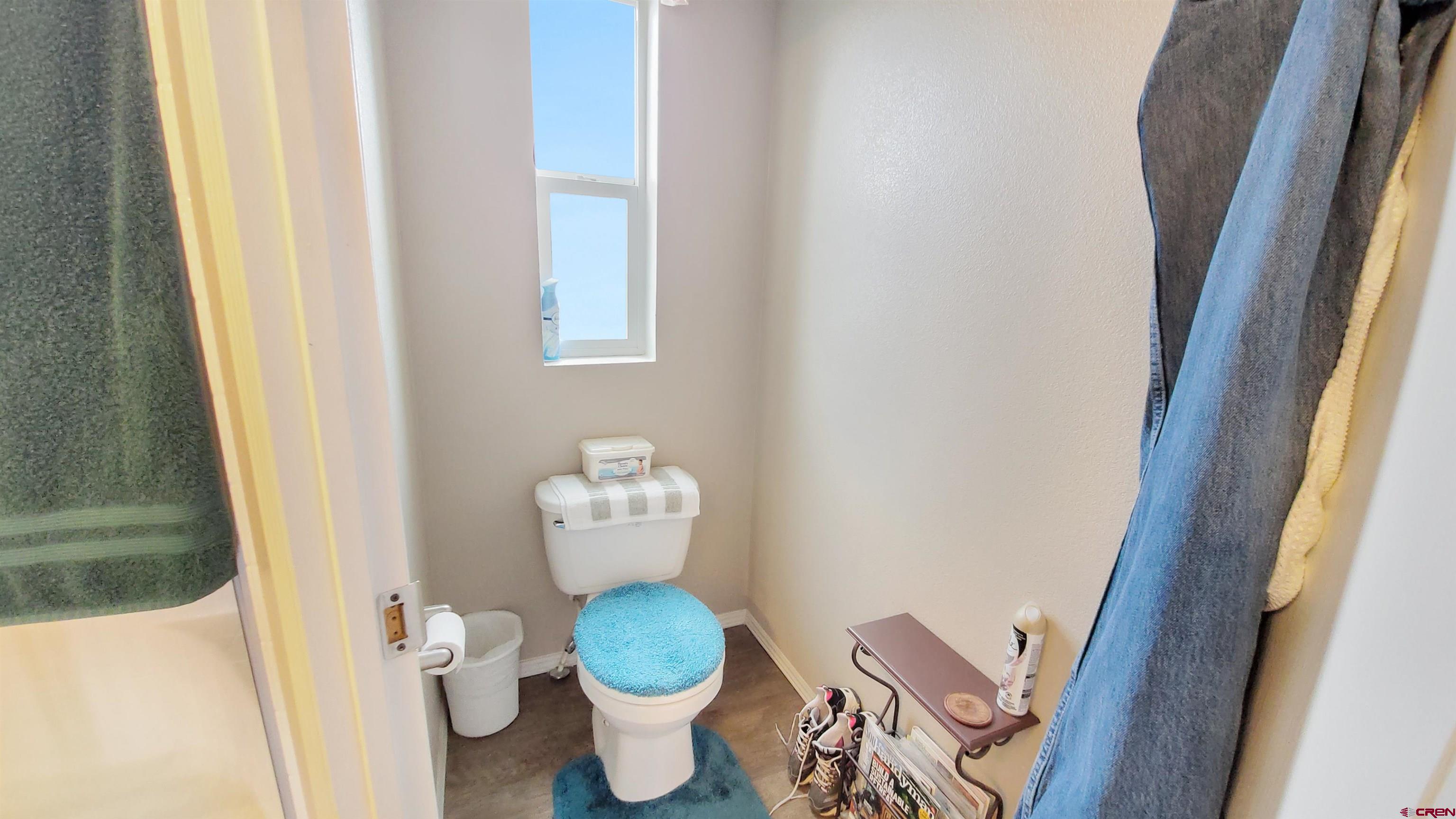 13635 County Road 23 Cortez, CO 81321 - Photo 20 of 30 a white toilet sitting next to a small sink
