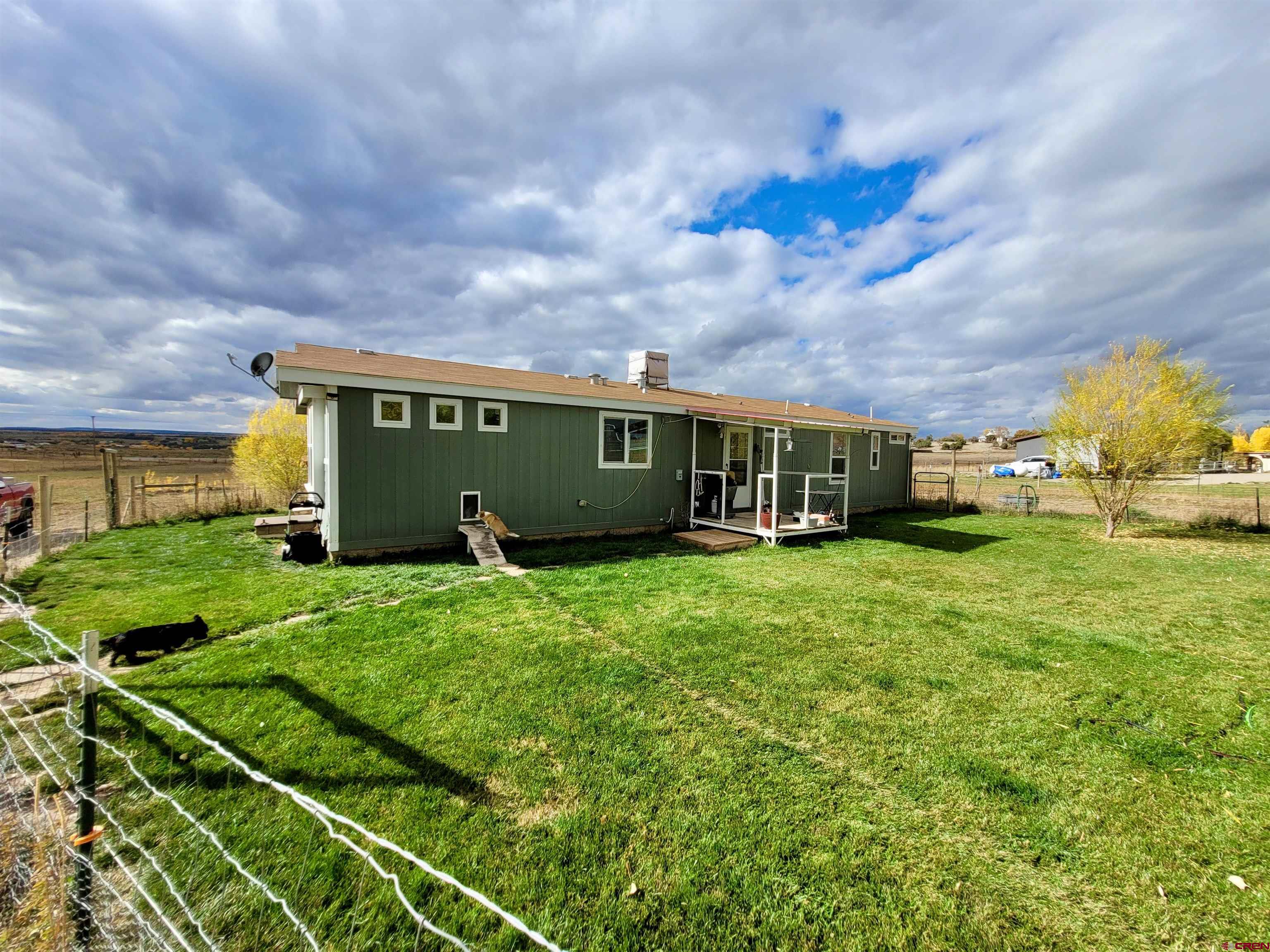 13635 County Road 23 Cortez, CO 81321 - Photo 3 of 30 a view of a house with backyard