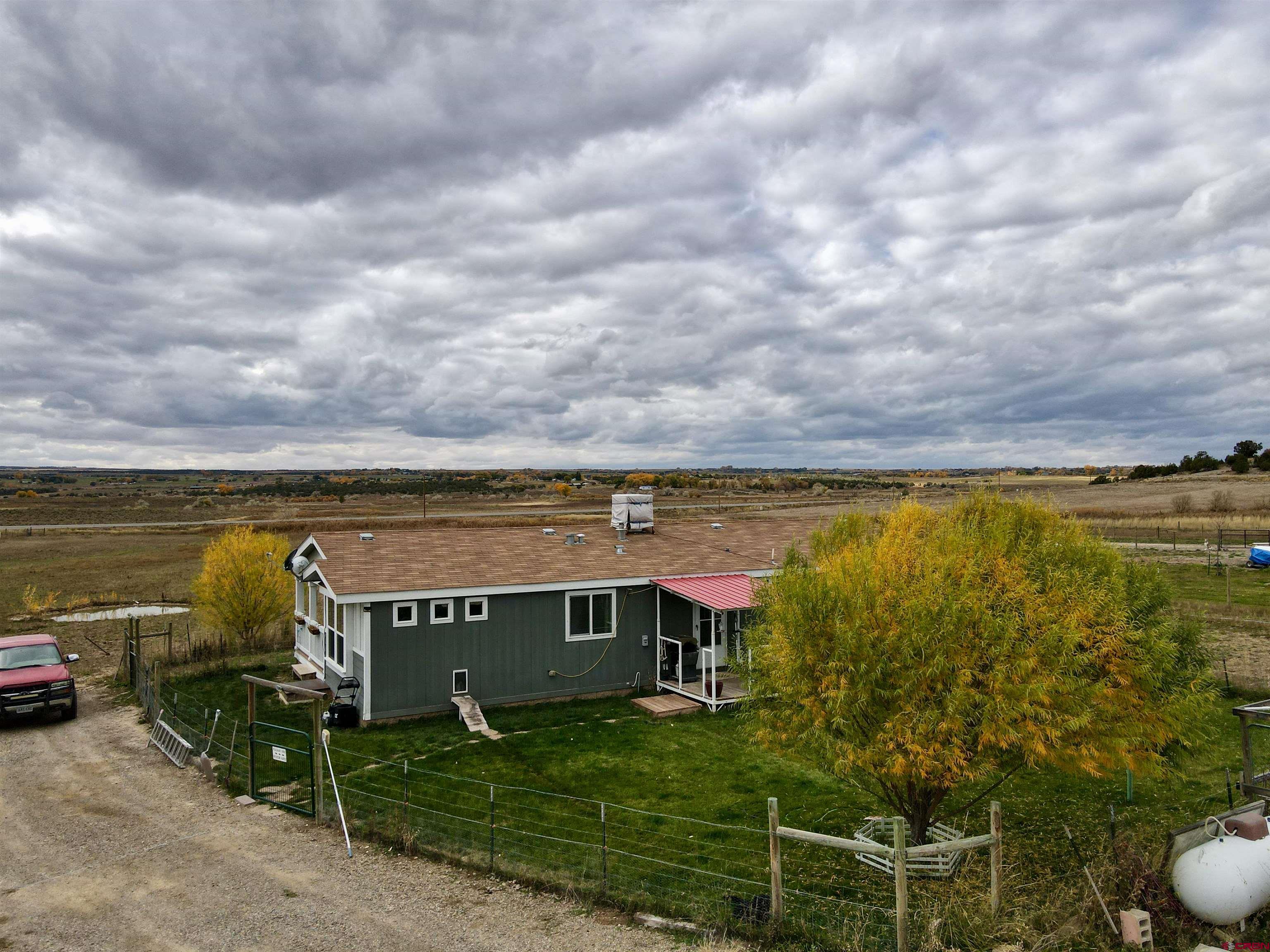 13635 County Road 23 Cortez, CO 81321 - Photo 4 of 30 a view of a terrace with a garden