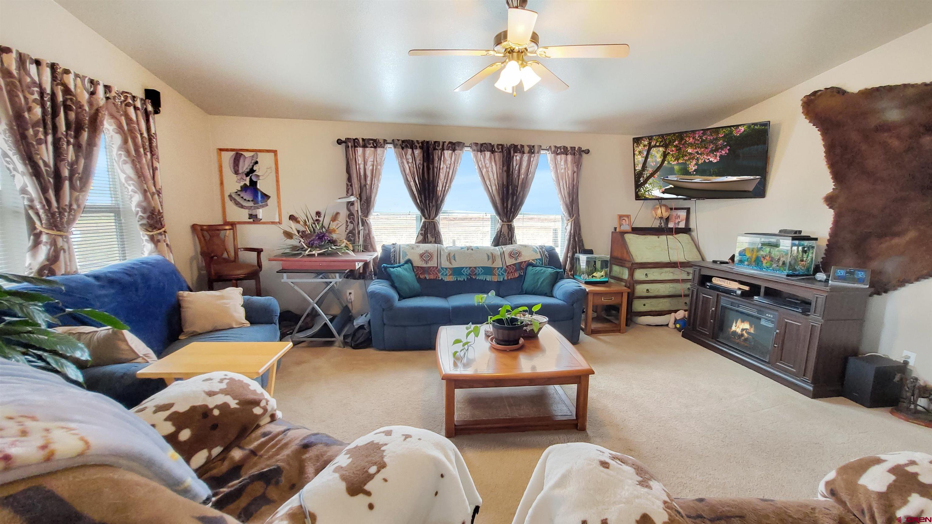 13635 County Road 23 Cortez, CO 81321 - Photo 6 of 30 a living room with furniture and a large window