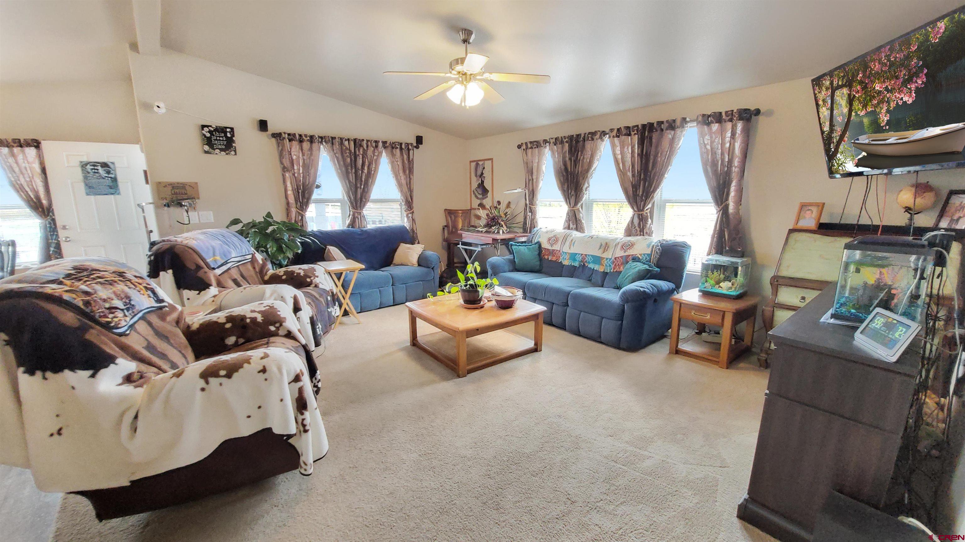 13635 County Road 23 Cortez, CO 81321 - Photo 7 of 30 a living room with furniture and a large window