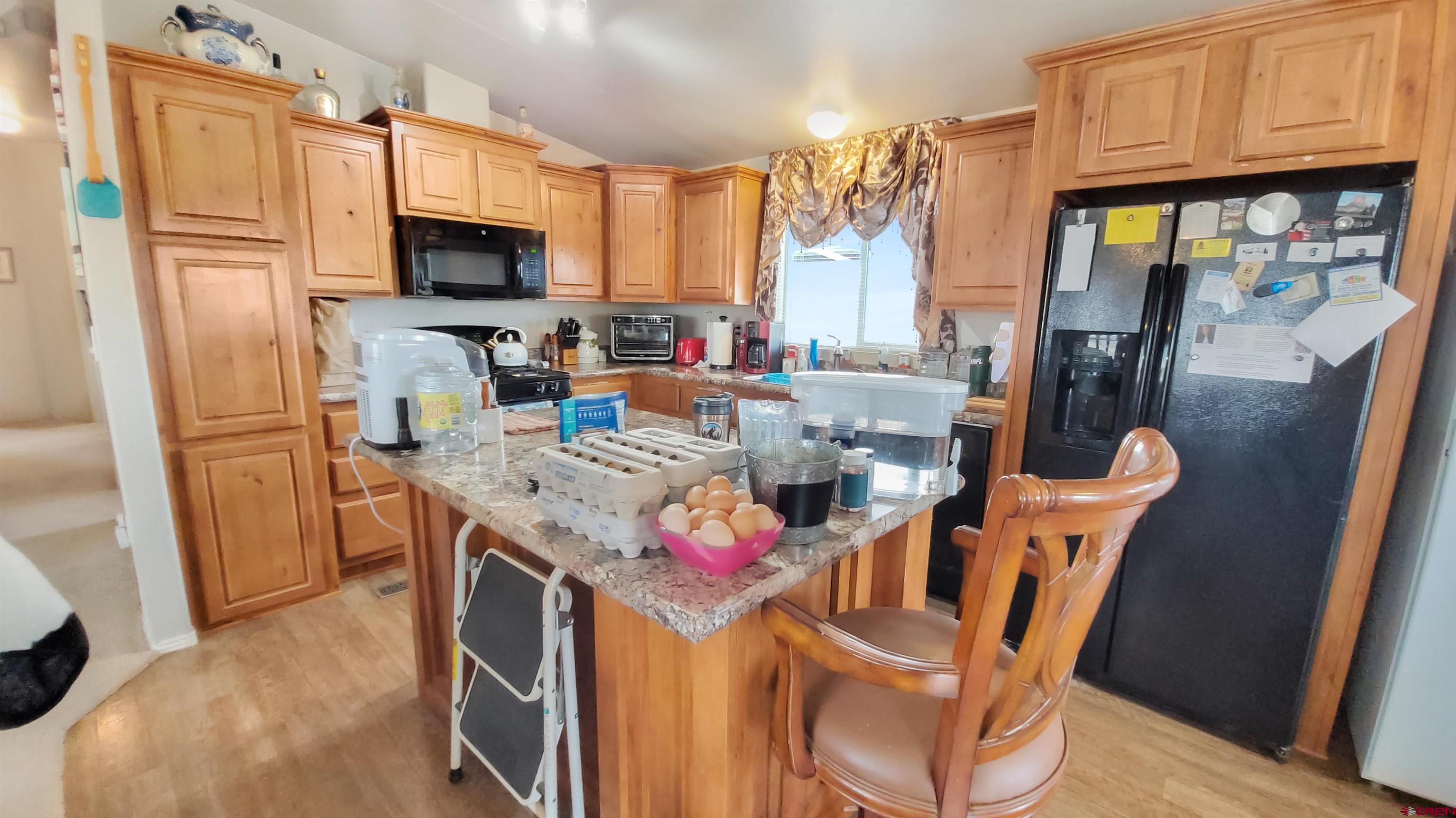13635 County Road 23 Cortez, CO 81321 - Photo 10 of 30 a view of a kitchen with furniture and a window