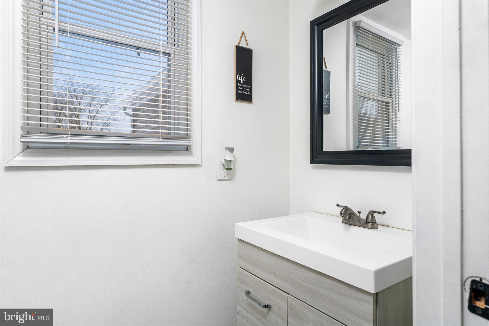 3 Scenic View Drive Sicklerville, NJ 08081 - Photo 13 of 26 a bathroom with a sink and a mirror