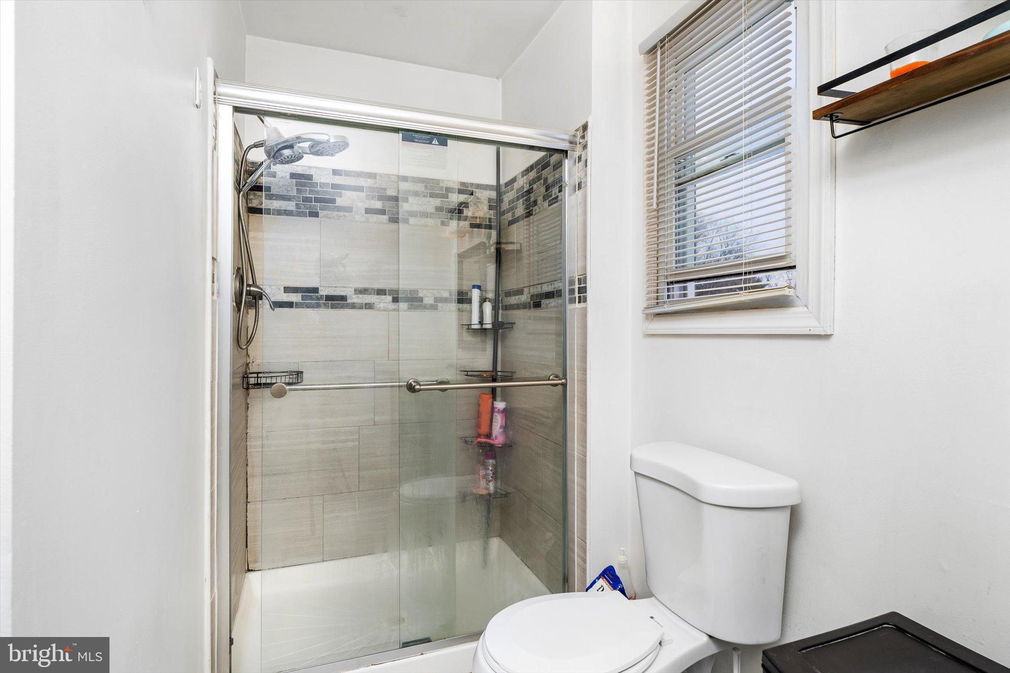 3 Scenic View Drive Sicklerville, NJ 08081 - Photo 22 of 26 a white toilet sitting next to a bathroom sink