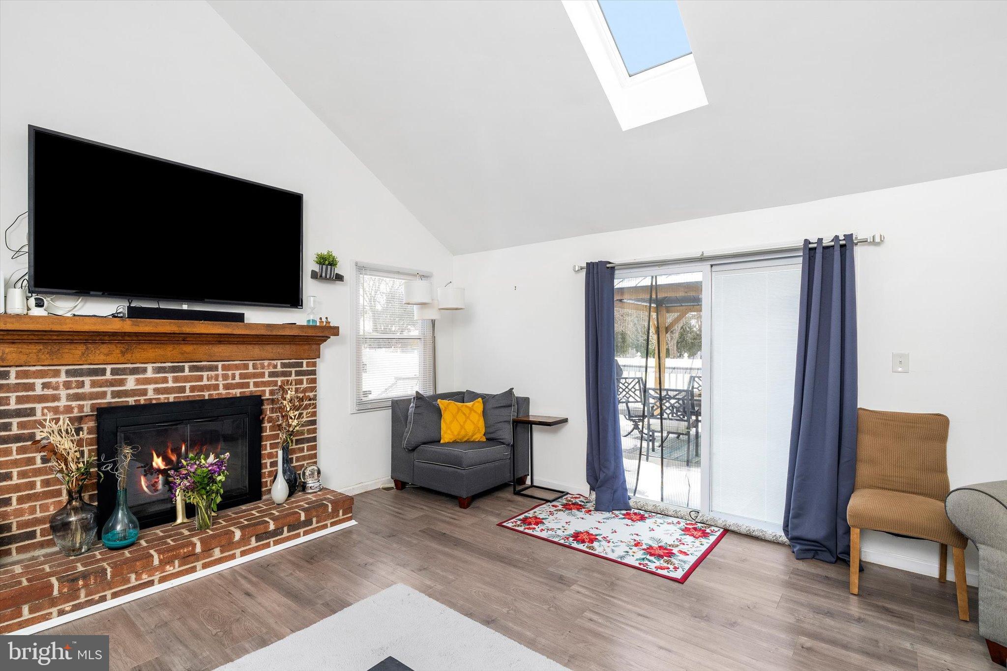 3 Scenic View Drive Sicklerville, NJ 08081 - Photo 10 of 26 a living room with furniture a flat screen tv and a fireplace