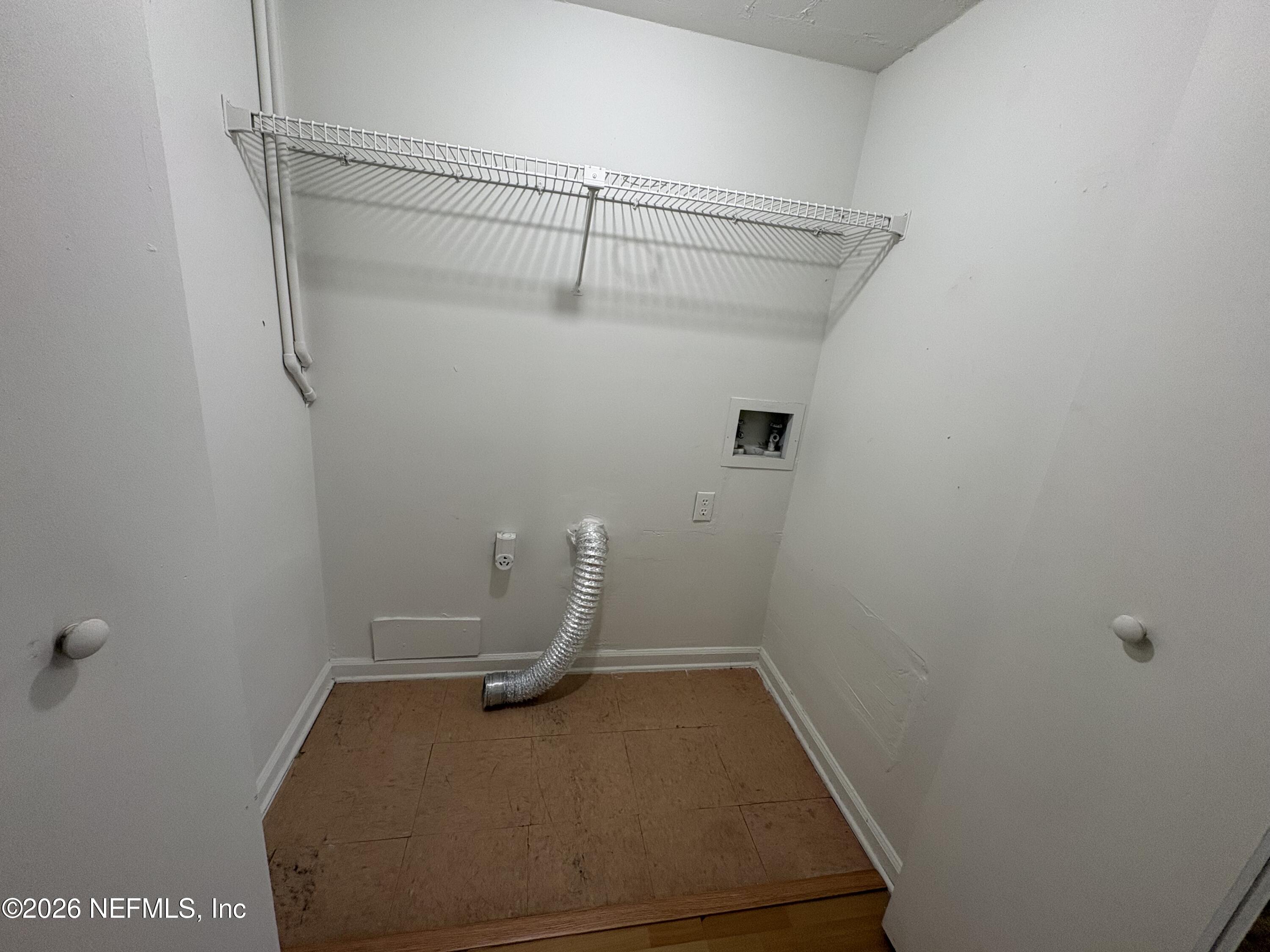 4647 Barnes Road South Jacksonville, FL 32207 - Photo 7 of 11 a view of a room with racks on the wall