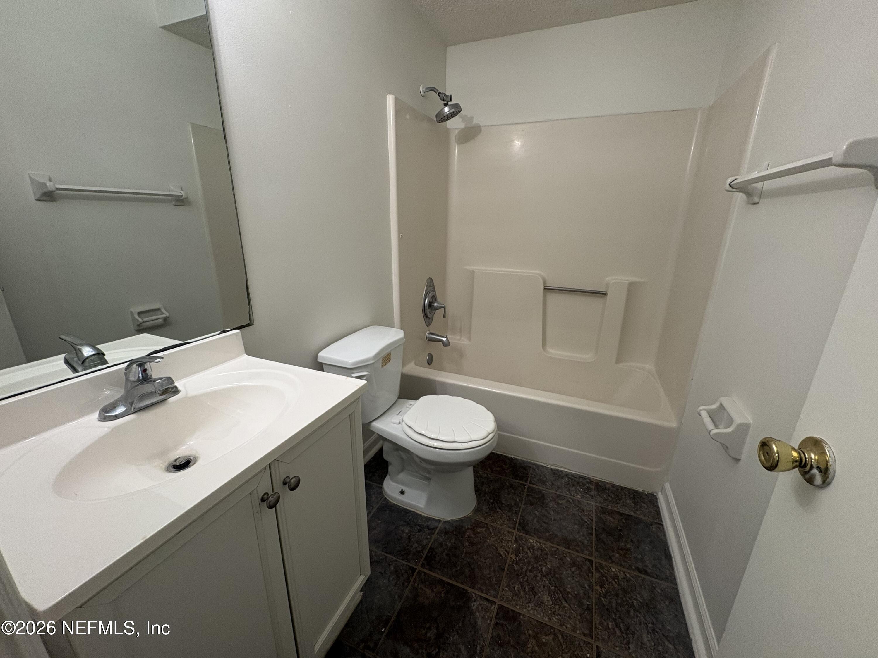 4647 Barnes Road South Jacksonville, FL 32207 - Photo 9 of 11 a bathroom with a sink toilet and shower