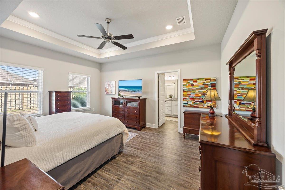 5344 Red Shoulder Road Pace, FL 32571 - Photo 16 of 28 a large bedroom with a bed dresser and a window