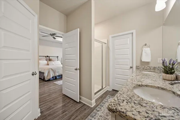 a bedroom with a bed and a view of bathroom