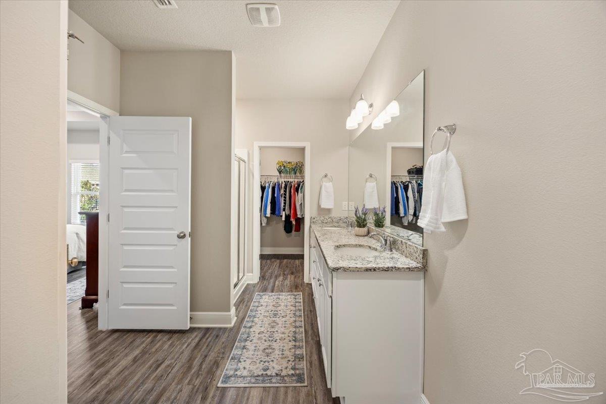 5344 Red Shoulder Road Pace, FL 32571 - Photo 19 of 28 a bathroom with a sink and mirror