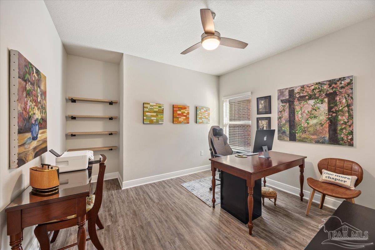 5344 Red Shoulder Road Pace, FL 32571 - Photo 23 of 28 a view of a workspace with furniture and a window