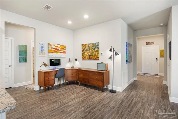 a view of living room with furniture and flat screen tv