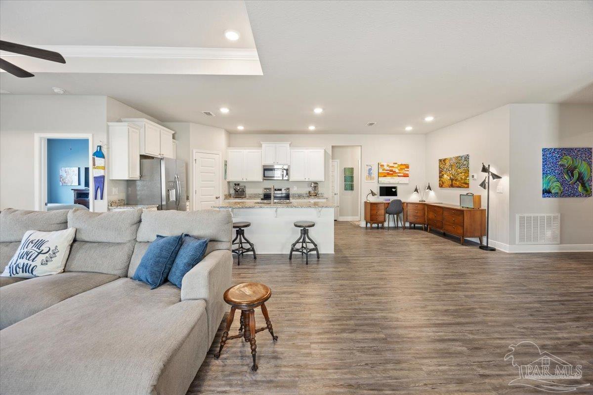 5344 Red Shoulder Road Pace, FL 32571 - Photo 10 of 28 a living room with furniture and view of kitchen