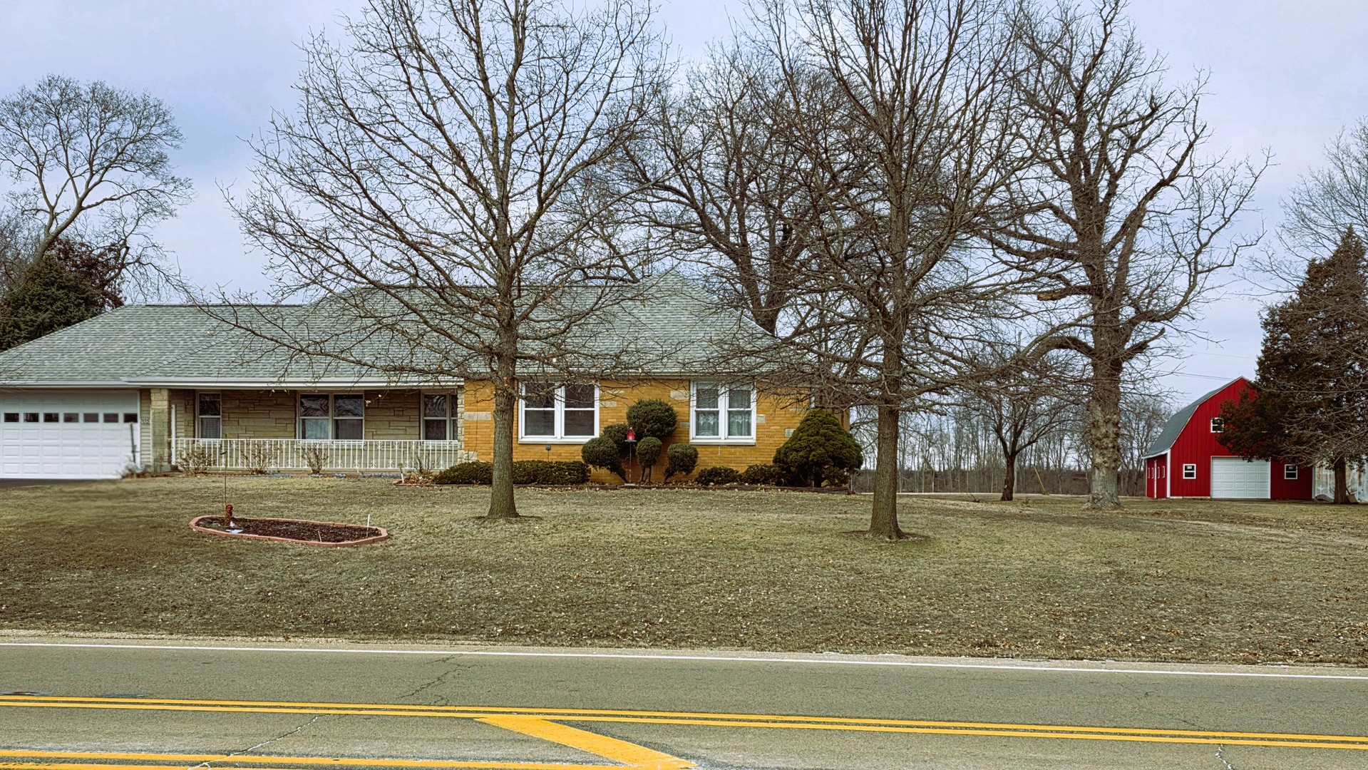 705 West Commercial Street Lyndon, IL 61261 - Photo 2 of 17 a view of a house with a backyard