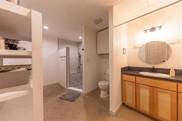 a bathroom with a shower and a toilet