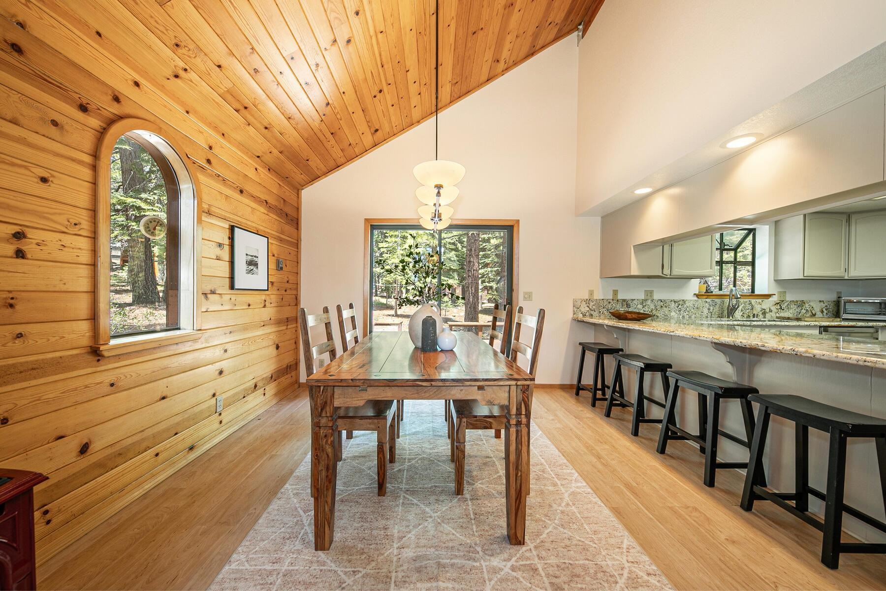 13515 Ski View Loop Truckee, CA 96161 - Photo 13 of 28 a view of a dining room with furniture window and wooden floor