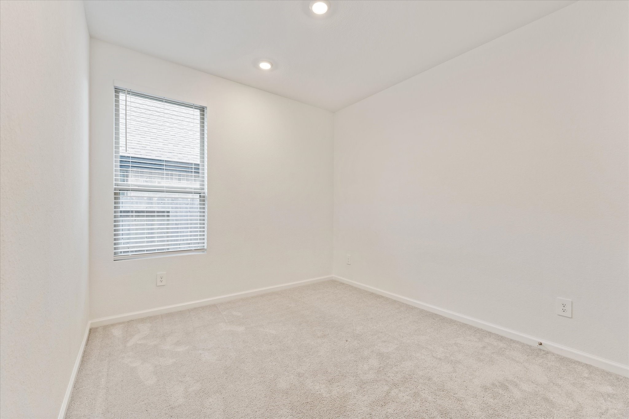 15520 Sunset Maple Court Conroe, TX 77302 - Photo 21 of 46 an empty room with a window