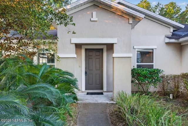 a kitchen with stainless steel appliances granite countertop a sink and a refrigerator