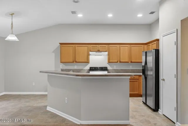 a view of a livingroom with a ceiling fan and window