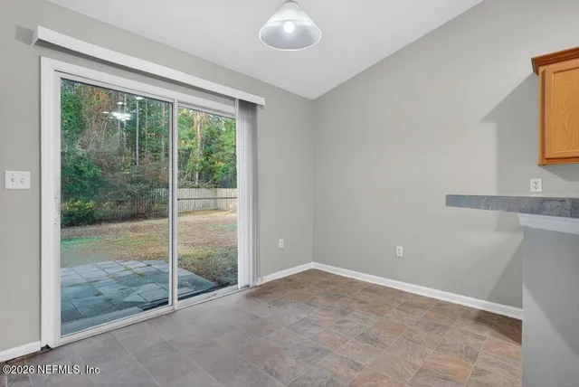 a bathroom with a granite countertop sink a toilet and mirror