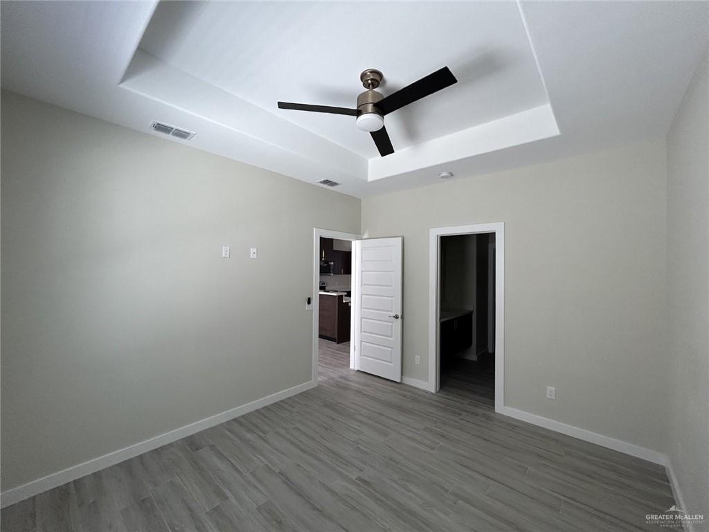 1320 North McColl Road, Unit 2 Edinburg, TX 78541 - Photo 17 of 24 a view of empty room with wooden floor