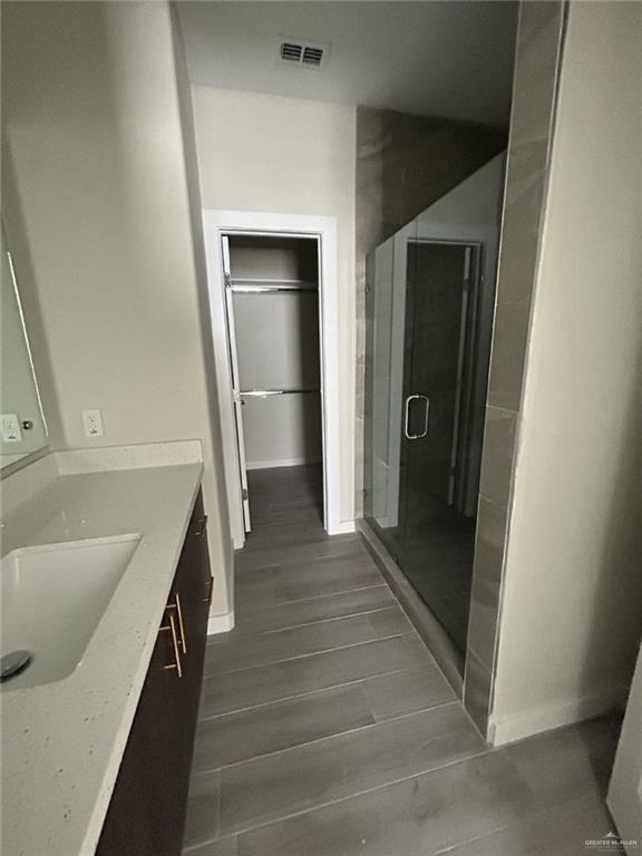 1320 North McColl Road, Unit 2 Edinburg, TX 78541 - Photo 18 of 24 a hallway with wooden floor and staircase