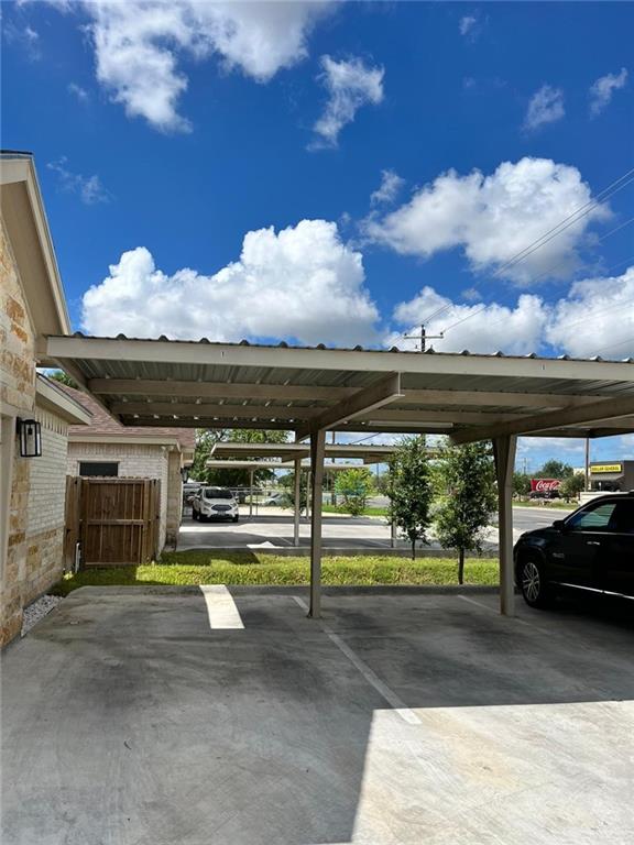 1320 North McColl Road, Unit 2 Edinburg, TX 78541 - Photo 2 of 24 a view of a swimming pool with an outdoor seating and a yard
