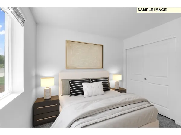 a bedroom with a bed and window