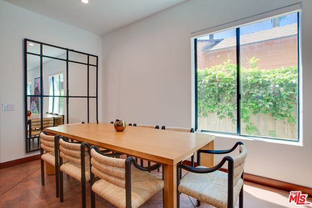 an entryway with wooden floor