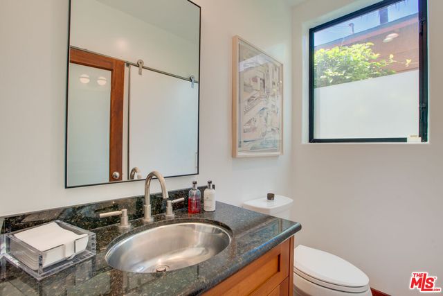 a view of entryway and gallery with wooden floor
