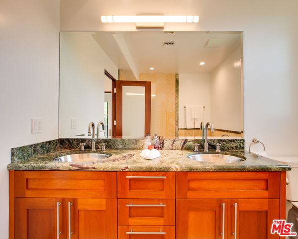 a bathroom with a tub a sink and a shower