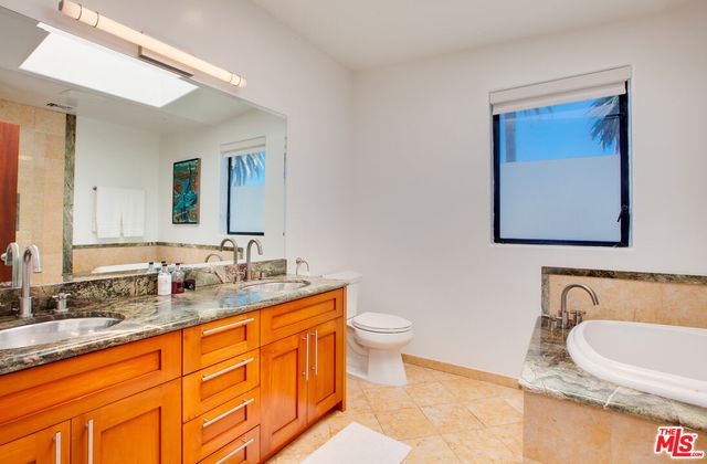 a bathroom with sink and mirror
