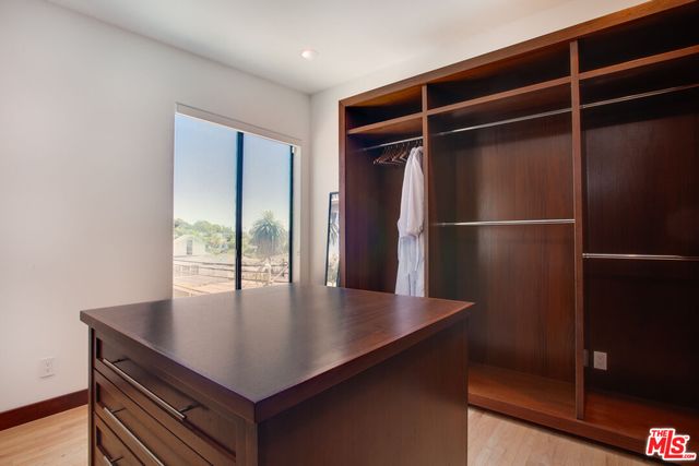 a view of an entryway with wooden floor and a window