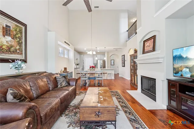 a living room with furniture fireplace and flat screen tv