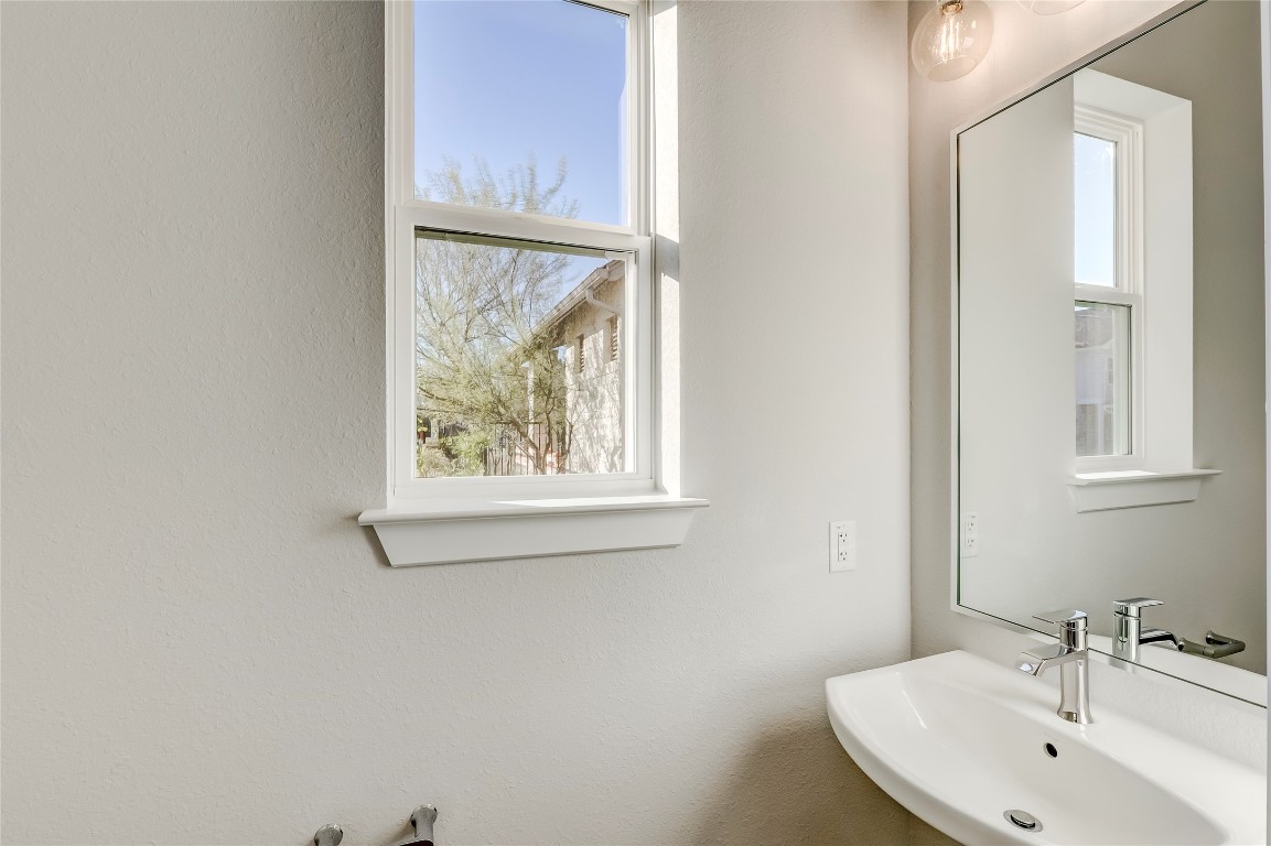 715 Bernese Pass Austin, TX 78745 - Photo 16 of 38 Bathroom featuring a textured wall and healthy amount of natural light