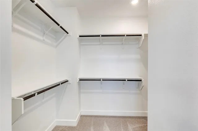a bathroom with a double vanity sink mirror and shower
