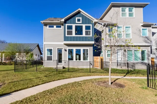 a view of a house with a yard patio and a yard