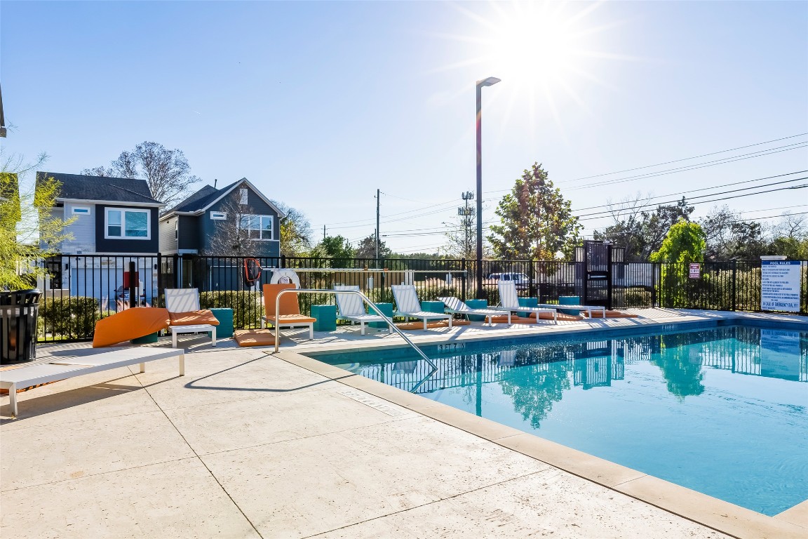 715 Bernese Pass Austin, TX 78745 - Photo 37 of 38 Community pool with a patio area