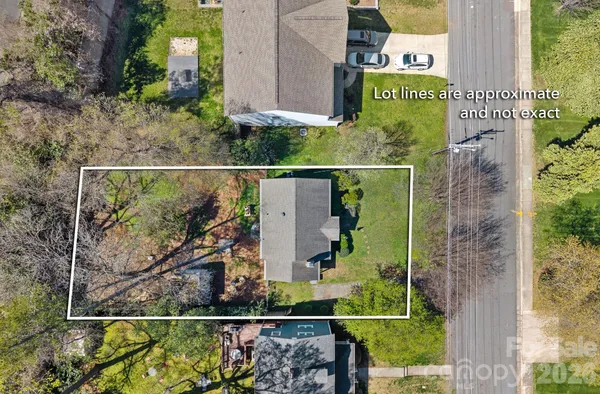 front view of a house with a sign on it