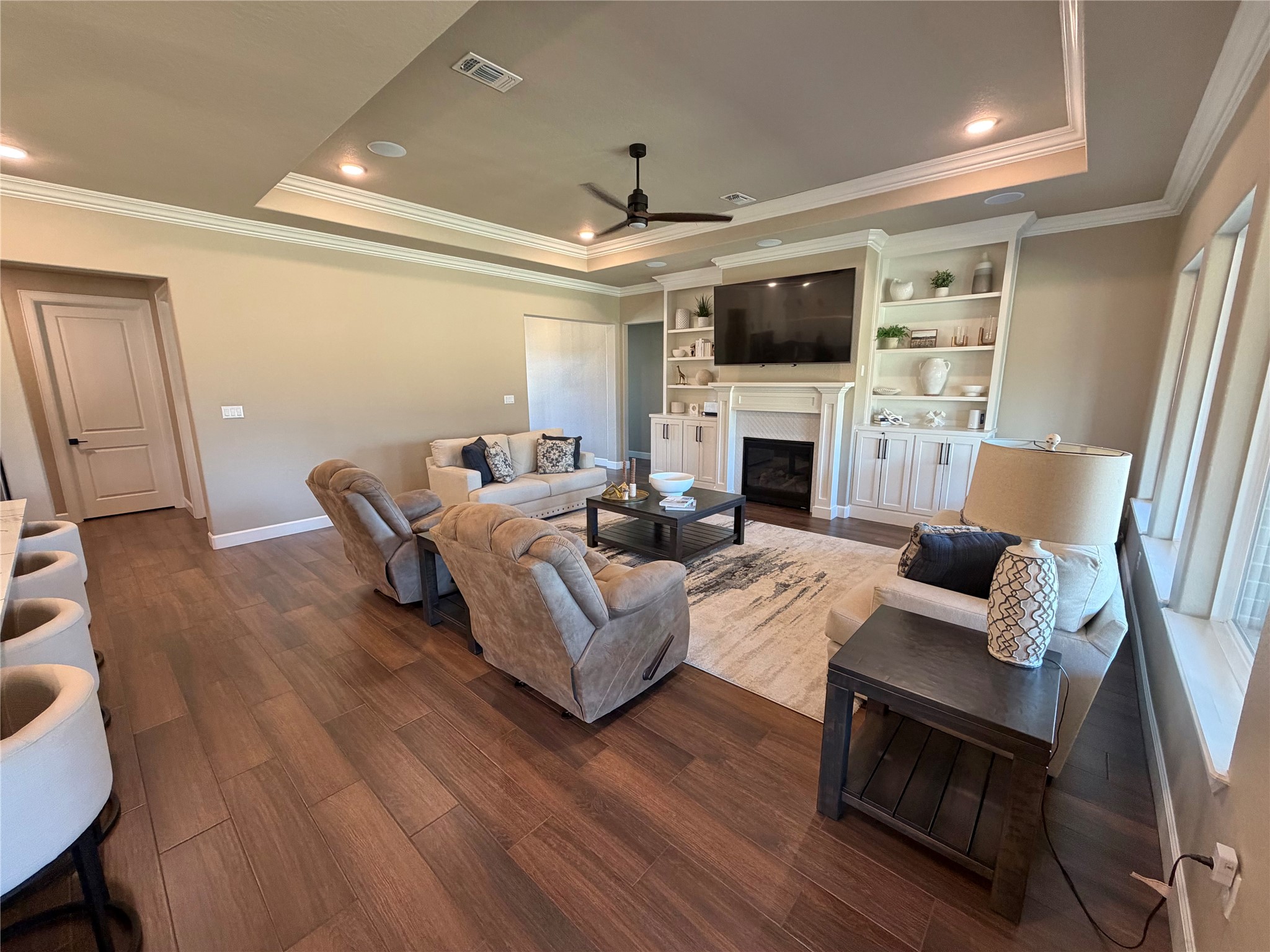 838 Oak Ridge Drive Angleton, TX 77515 - Photo 11 of 49 a living room with furniture a flat screen tv and a fireplace