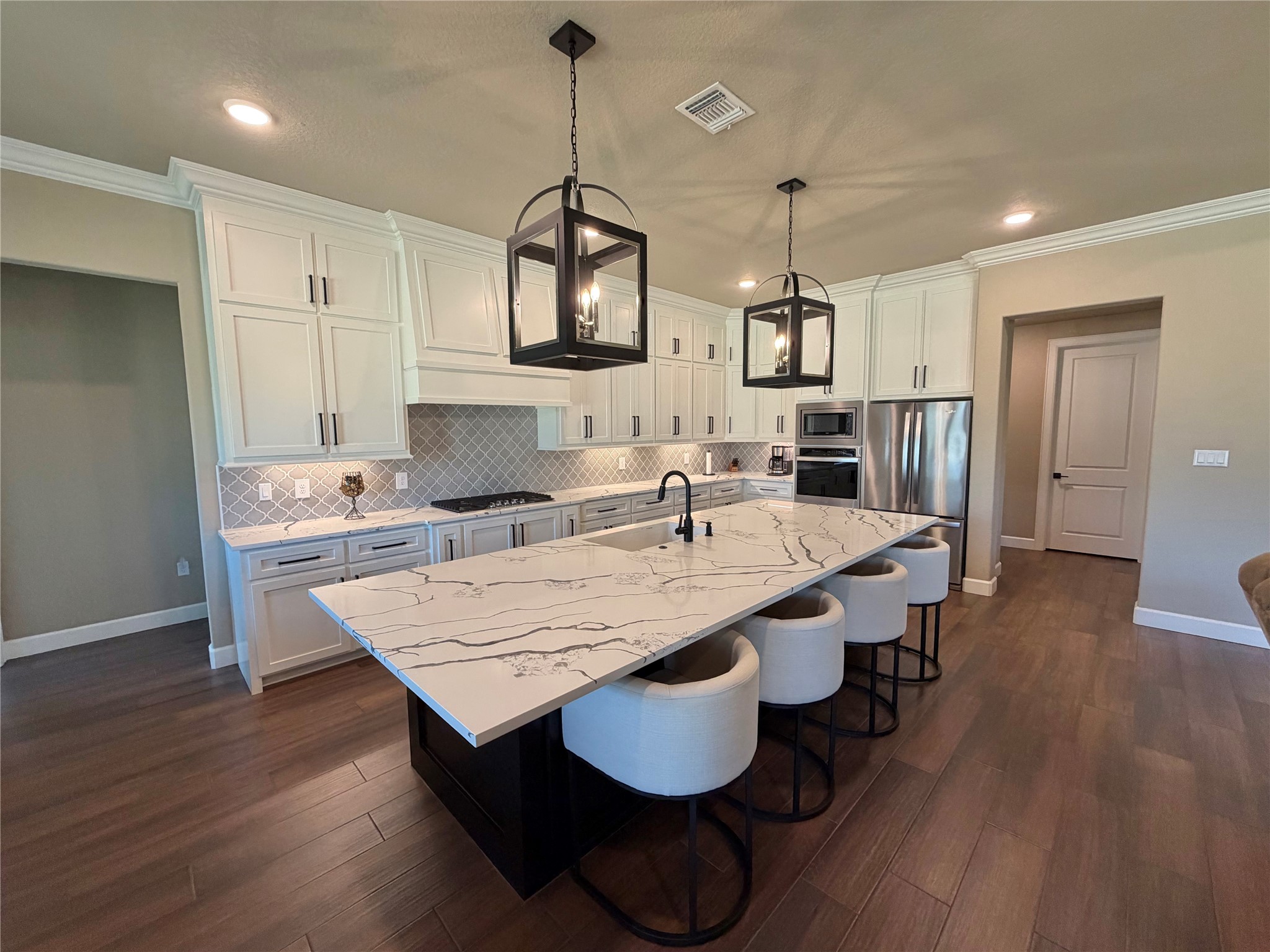 838 Oak Ridge Drive Angleton, TX 77515 - Photo 15 of 49 a large kitchen with a table and chairs
