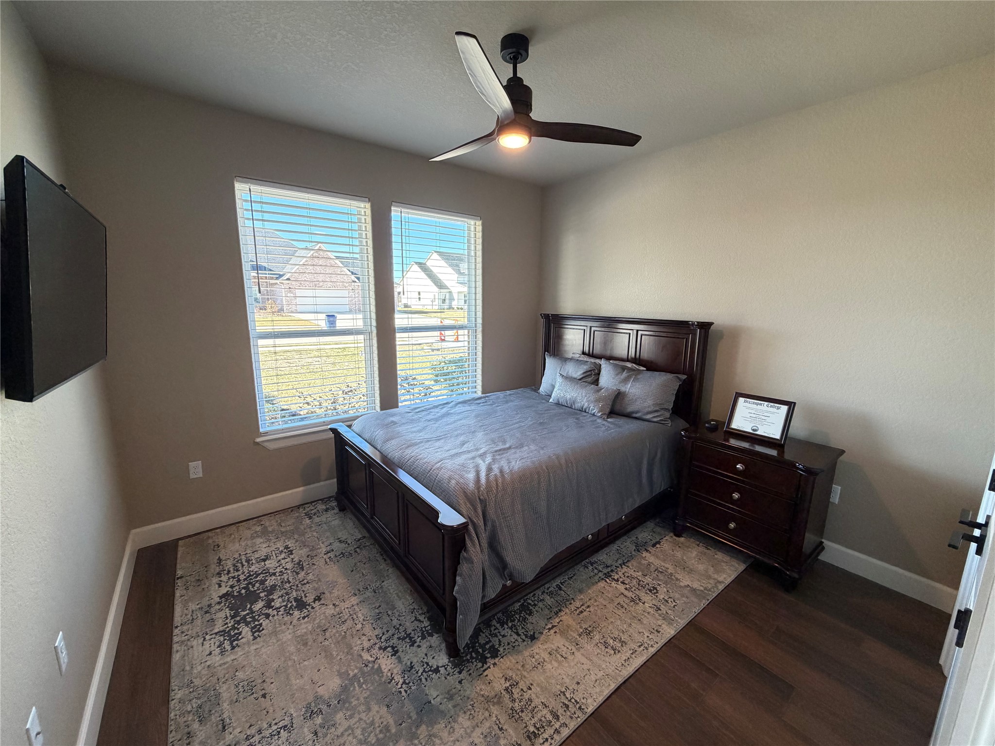 838 Oak Ridge Drive Angleton, TX 77515 - Photo 25 of 49 a bedroom with a bed and a tv
