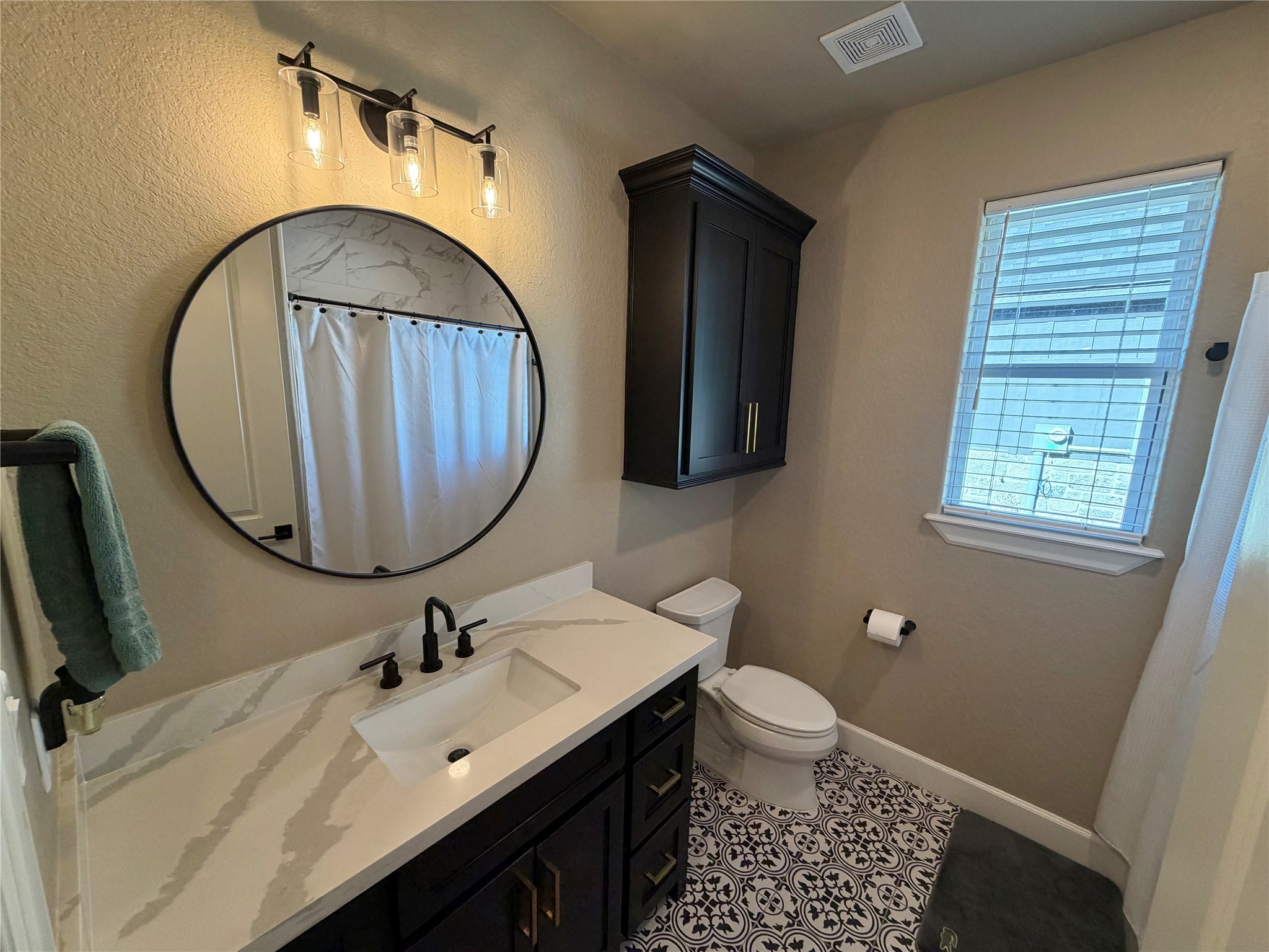 838 Oak Ridge Drive Angleton, TX 77515 - Photo 26 of 49 a bathroom with a sink a toilet and a mirror