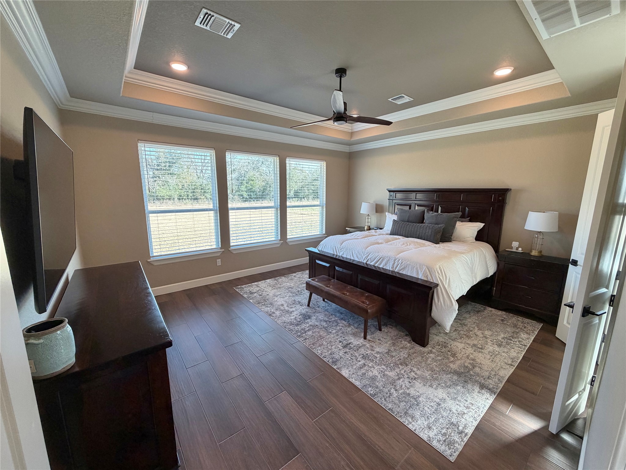 838 Oak Ridge Drive Angleton, TX 77515 - Photo 34 of 49 a bedroom with a bed and a flat screen tv