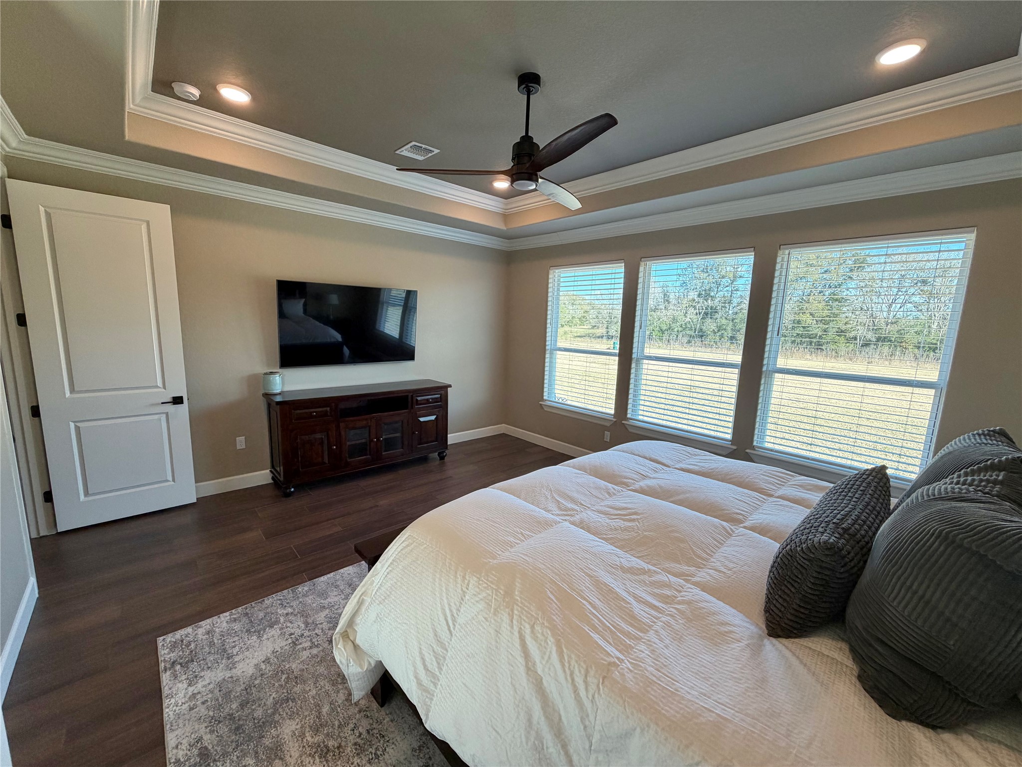 838 Oak Ridge Drive Angleton, TX 77515 - Photo 42 of 49 a spacious bedroom with a bed and a flat screen television