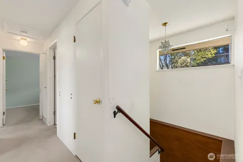 a view of a hallway with closet