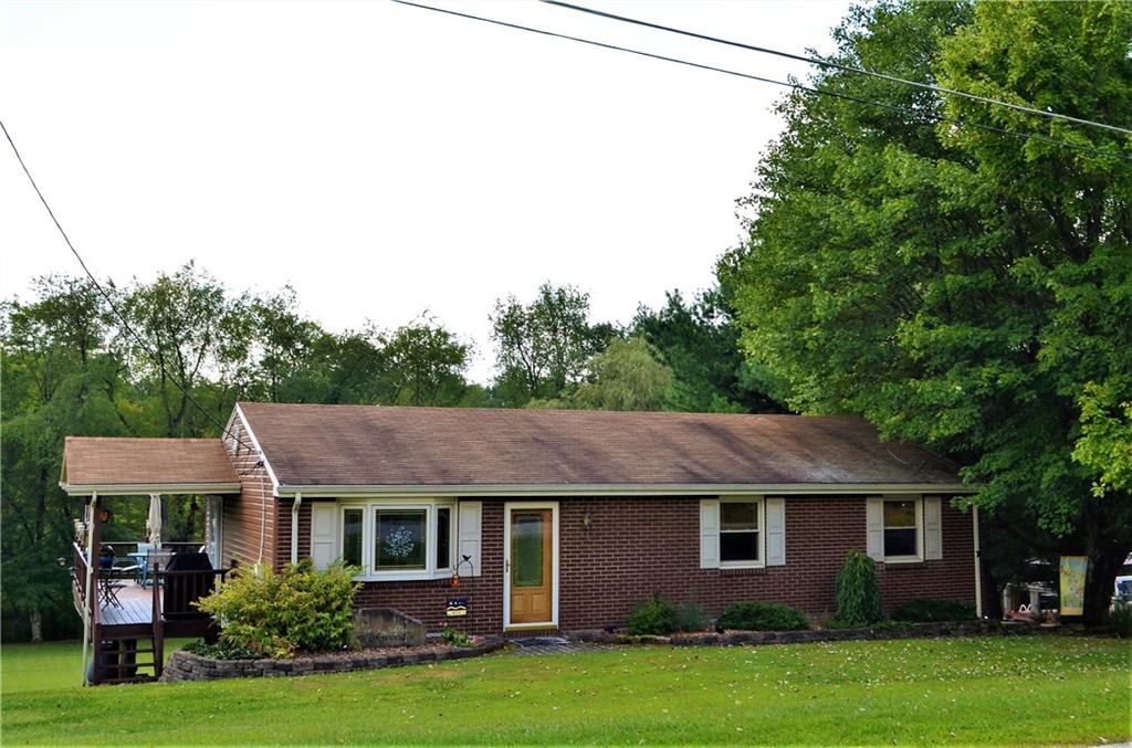 Comfortable country ranch home on nicely landscaped 1/2 acre+ lot!