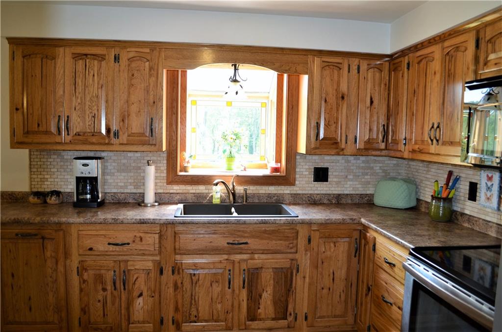 210 Jones Road Cabot, PA 16023 - Photo 6 of 25 Rustic Hickory cabinets and garden window for lots of natural light!