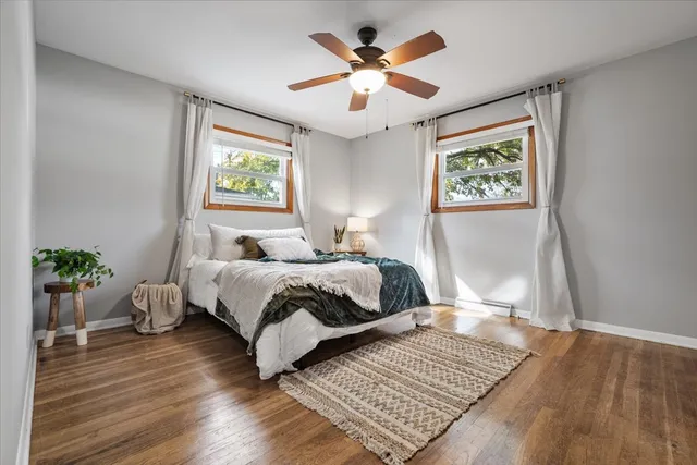 a bedroom with a large bed and a window